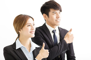 smiling businesswoman and businessman with thumbs up