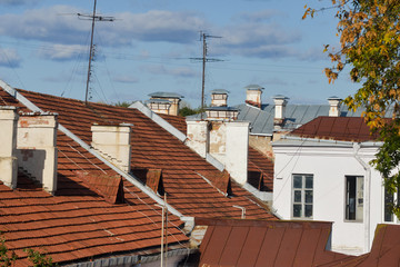 Fototapeta na wymiar Fragments of several houses with tiled roof