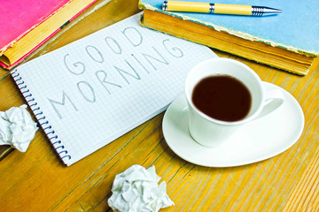 Coffee and pen in the wooden table