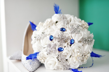 White wedding bouquet and bride shoes