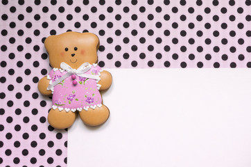 Polka-dot background with a honey-cake bear