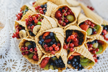 Mix of berry fruits in the ice cream cone