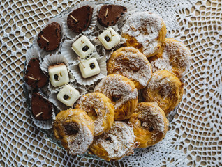 sweets on a table decorated with lace napkin
