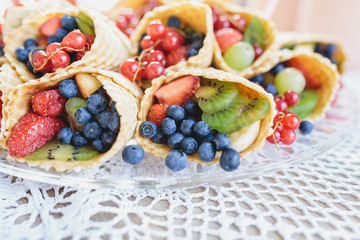Mix of berry fruits in the ice cream cone