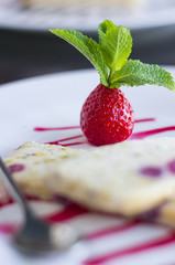 Strawberry with leaves of mint and semifreddo