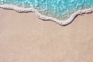 Fototapeta na wymiar Soft ocean wave on the sandy beach
