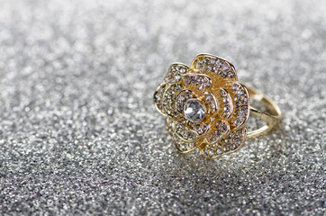 Jewellery ring against shiny background