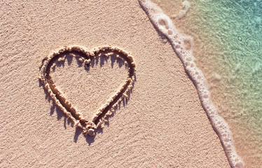 Heart symbol on the tropical beach