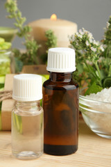 Essential oils on a wooden background. The concept of aromatherapy.
