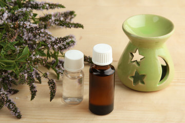 Essential oil on a wooden background. The concept of aromatherapy.