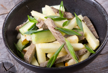 Asian salad with meat and pear