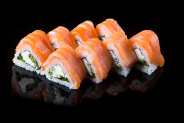 Japanese rolls on black background