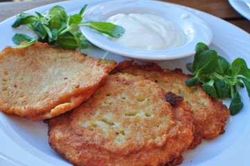 Potato cakes on white plate.