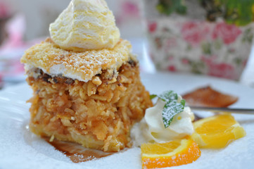 Apple pie cake with ice cream.