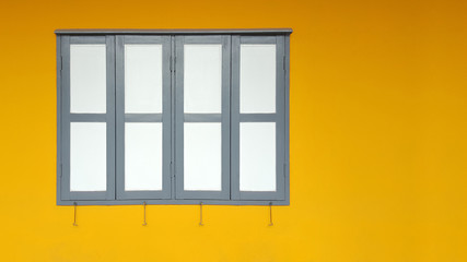 Window with yellow walls