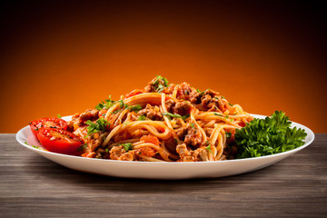Spaghetti with meat, tomato sauce and vegetables 