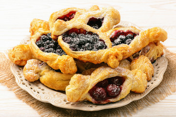 Puff pastries with cherries and blueberries.