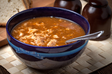 Traditional polish tripe soup with vegetables.