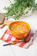 Traditional polish tripe soup with vegetables.