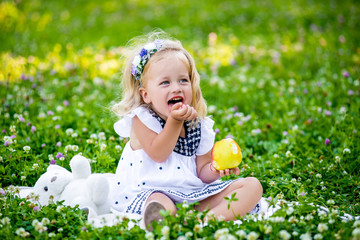 young beautiful baby girl eat apple