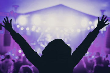 Girl enjoying the music festival / concert.
