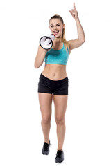 Young isolated female trainer holding megaphone