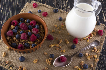 Muesli with fresh berries and milk.