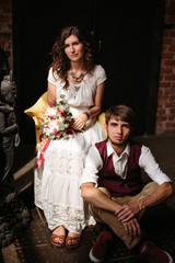 Stylish wedding couple in loft interior