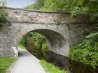 Fototapeta na wymiar Bridge over Llangollen canal with towpath in Wales UK