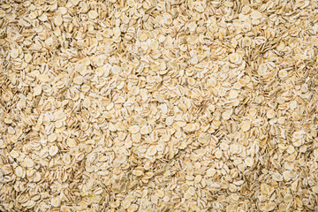 Oat flakes background.