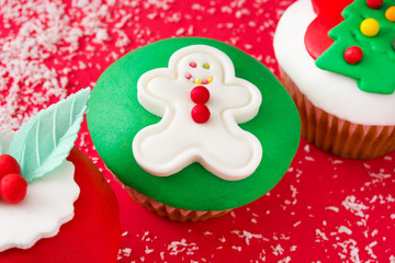 Christmas cupcakes on red background


