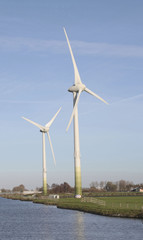 Two wind mills in a dutch landscape