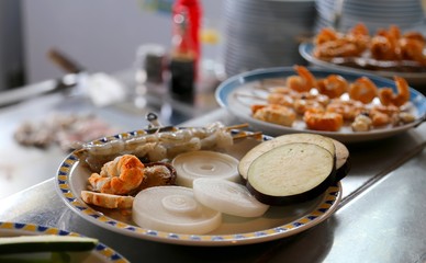 many food on the plates in the asian restaurant