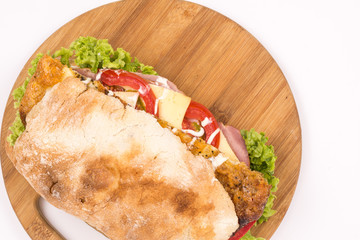 Flat lay bread sandwich meat lettuce tomato