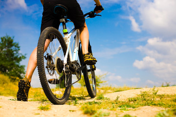 The athlete with the bike.