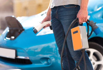 Hands of man holding power connector