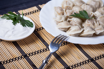 dumplings with sour cream on the table