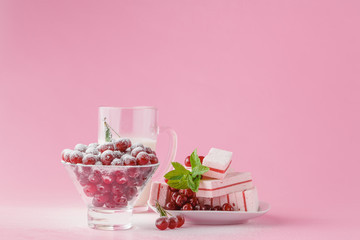 Glass of milk and wild cherry with sugar powder