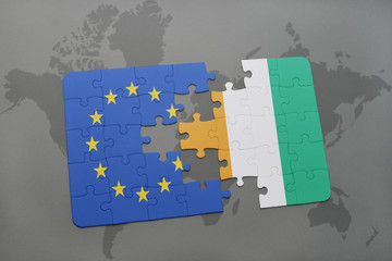 puzzle with the national flag of european union and cote divoire on a world map background.