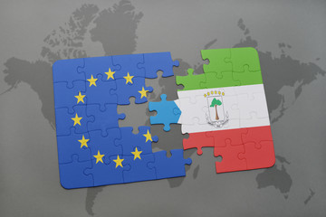 puzzle with the national flag of european union and equatorial guinea on a world map background.
