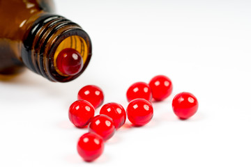 vitamin e capsules with opened bottle
