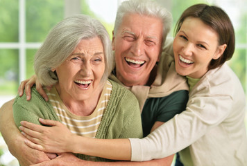 Happy senior parents with daughter