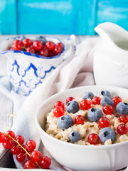 Colorful oatmeal porridge with fresh berries
