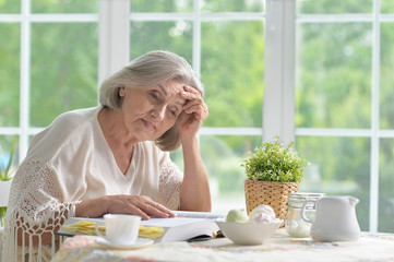 Senior woman with book 