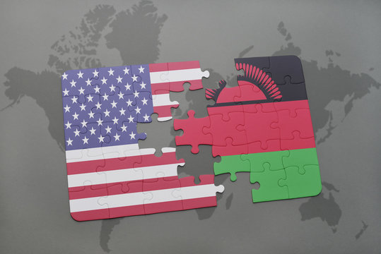 puzzle with the national flag of united states of america and malawi on a world map background.