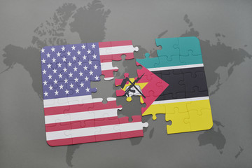puzzle with the national flag of united states of america and mozambique on a world map background.