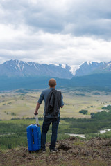 male traveler on a background of mountains