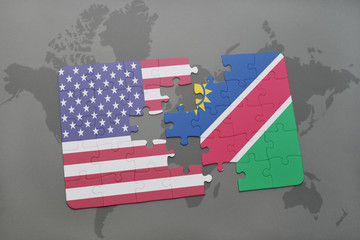 puzzle with the national flag of united states of america and namibia on a world map background.