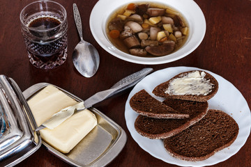 knife, still life, a glass of kvass,  spoon. on the table.
