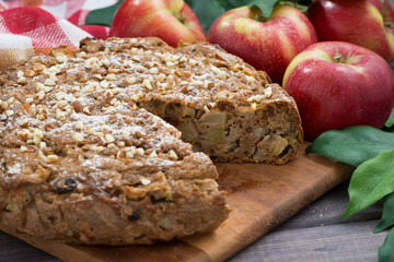 fresh apple pie in a cut on wooden board